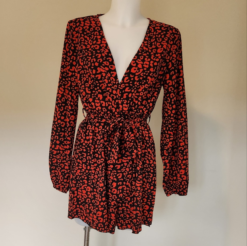 NWOT Leopard print long sleeve wrap front romper